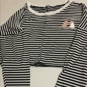 A long sleeved black & white shirt w/ love symbol